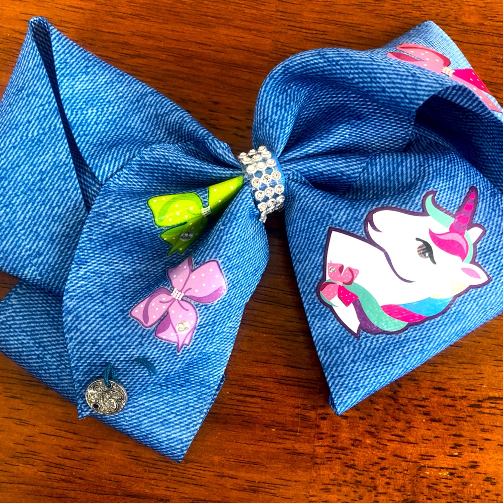 Oversized Denim-like JoJo Siwa Clip bow with Unicorn and “Dream” Rainbow